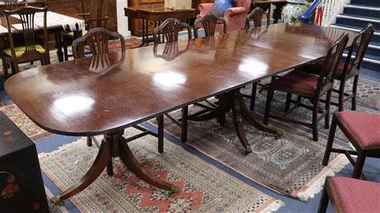 A George III style extending mahogany three-pillar dining table W.350cm